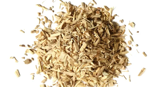Dried eleuthero root pieces on a white background